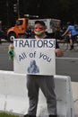 Ã¢â¬ÅTraitors All of You,Ã¢â¬Â Sign Held by a Male Protester Wearing a Wonder Woman Mask at the Justice for J6 Protest